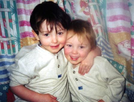 Eoghan and Aidan share a cuddle, January 2001