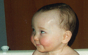 Eoghan in bath, aged about 9 months